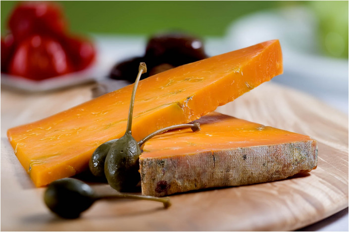 food photography with cheese and olives on plate